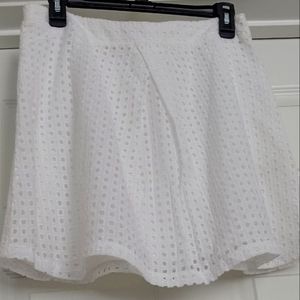Ladies white eyelet mini skirt . Fully lined size 14.